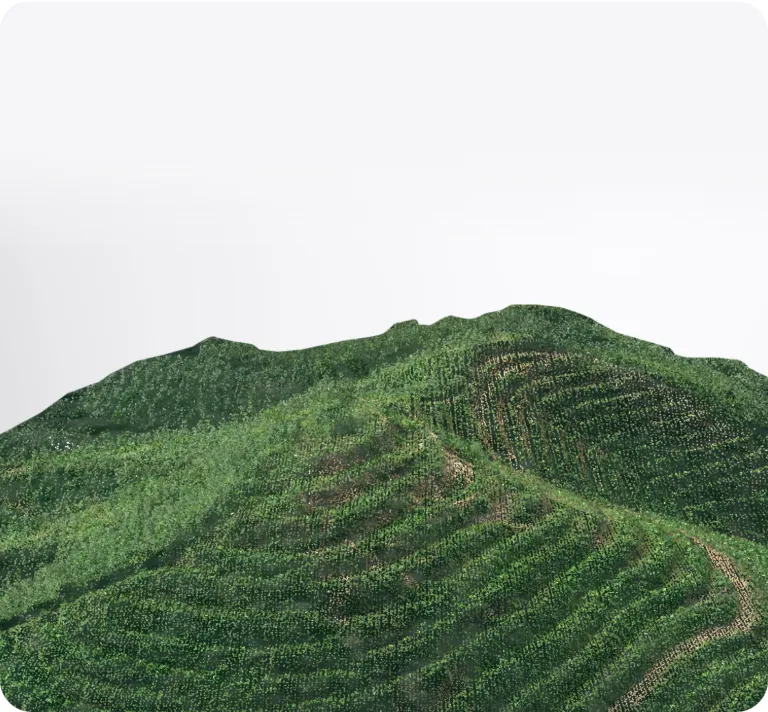 Green terraced hills or mountains with dense vegetation under a white sky.