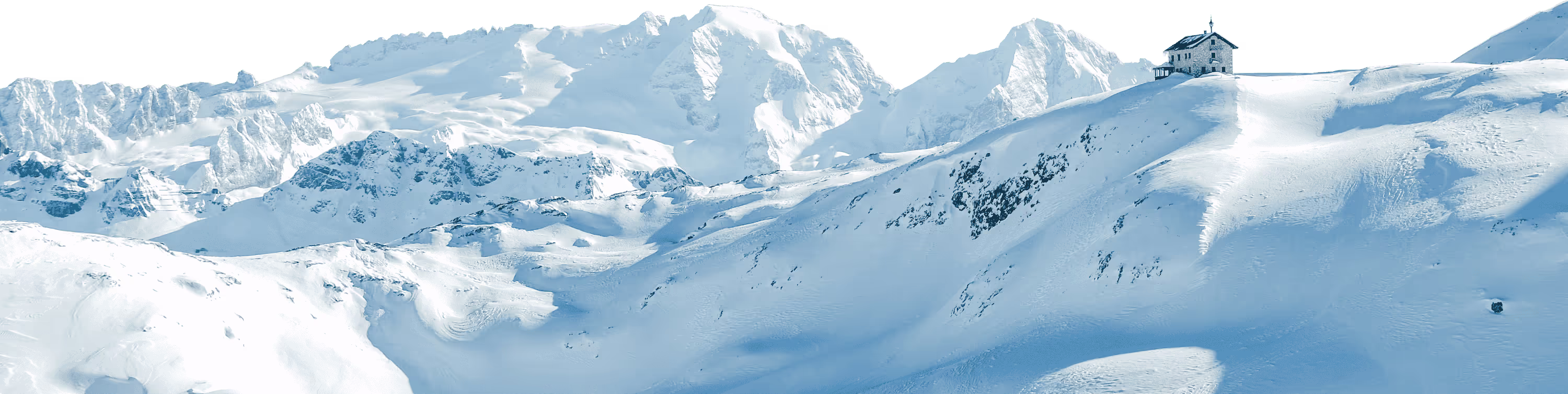 Snow-covered mountain range with a lone stone building on a ridge under clear skies.