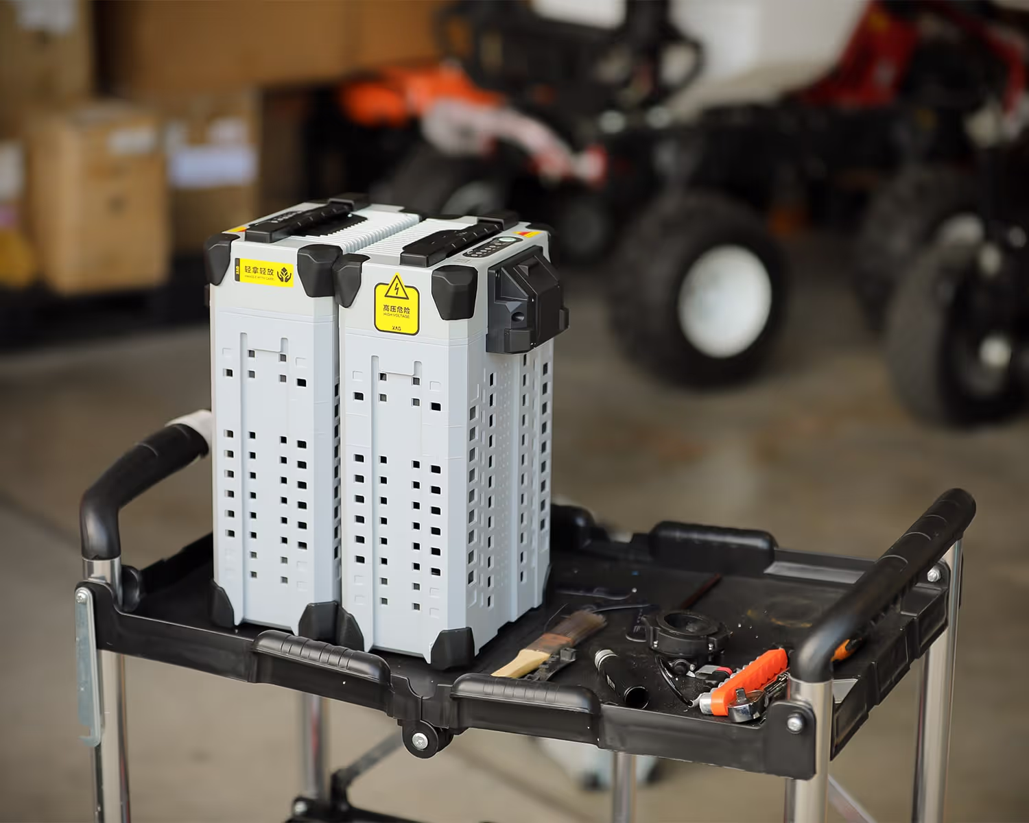 Portable battery pack with ventilation holes and reinforced black corners.