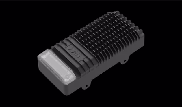 Black heat sink with ridged fins and a frosted translucent section on one end.
